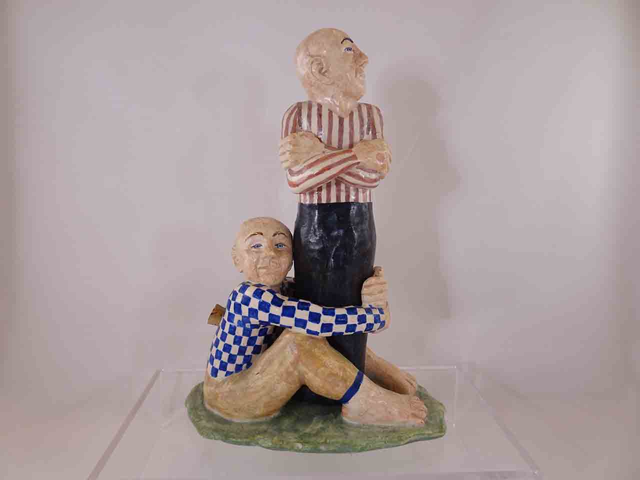 Man holding legs of other man salt and pepper shakers by Marilyn Andrews