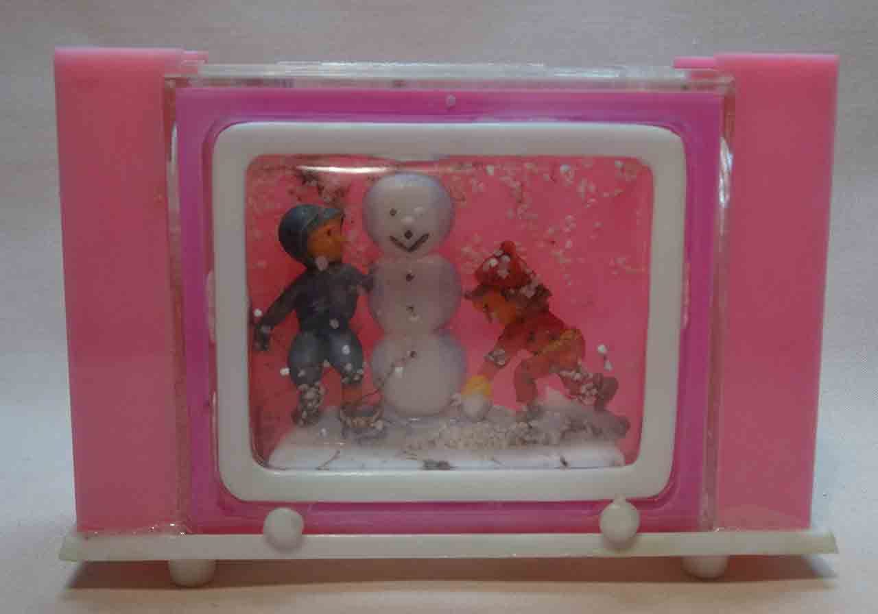 Kids in snow with snowman snow globe salt and pepper shaker