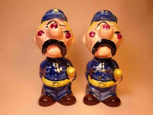 Clown-like strange fellows salt and pepper shakers - police officers