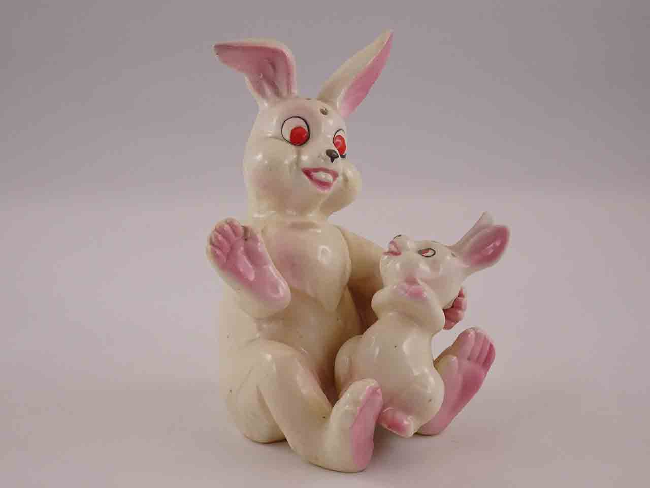 Mother rabbit holding bunny in lap salt and pepper shakers