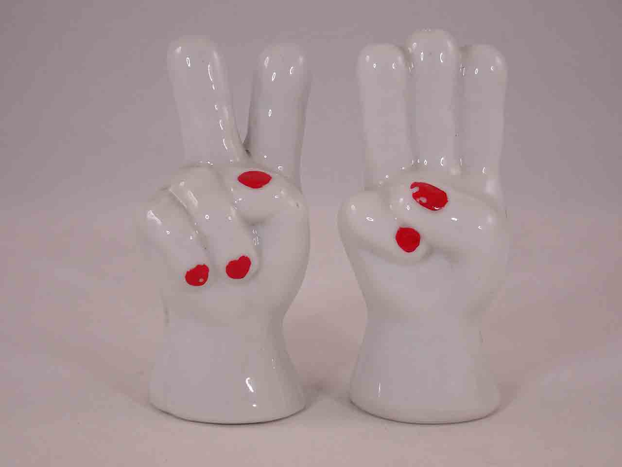 Hand salt and pepper shakers