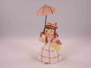 Girl holding umbrella salt and pepper shakers