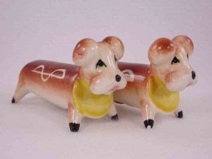 Longer animals with white squiggly lines on their sides salt and pepper shakers - dogs