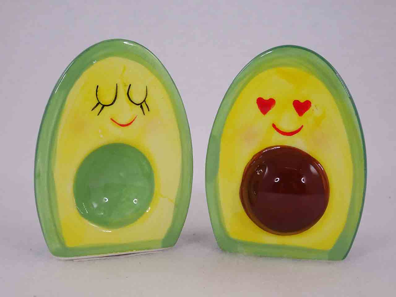 Anthropomorphic avocado halves in love salt and pepper shakers