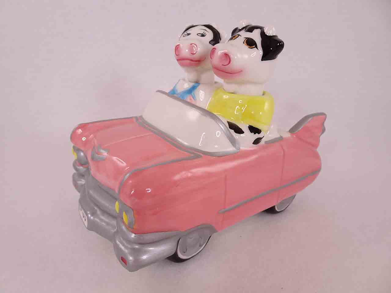 Clay Art cows in car nodder salt and pepper shakers