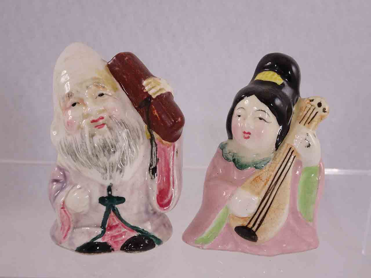 Little Asian people salt and pepper shakers