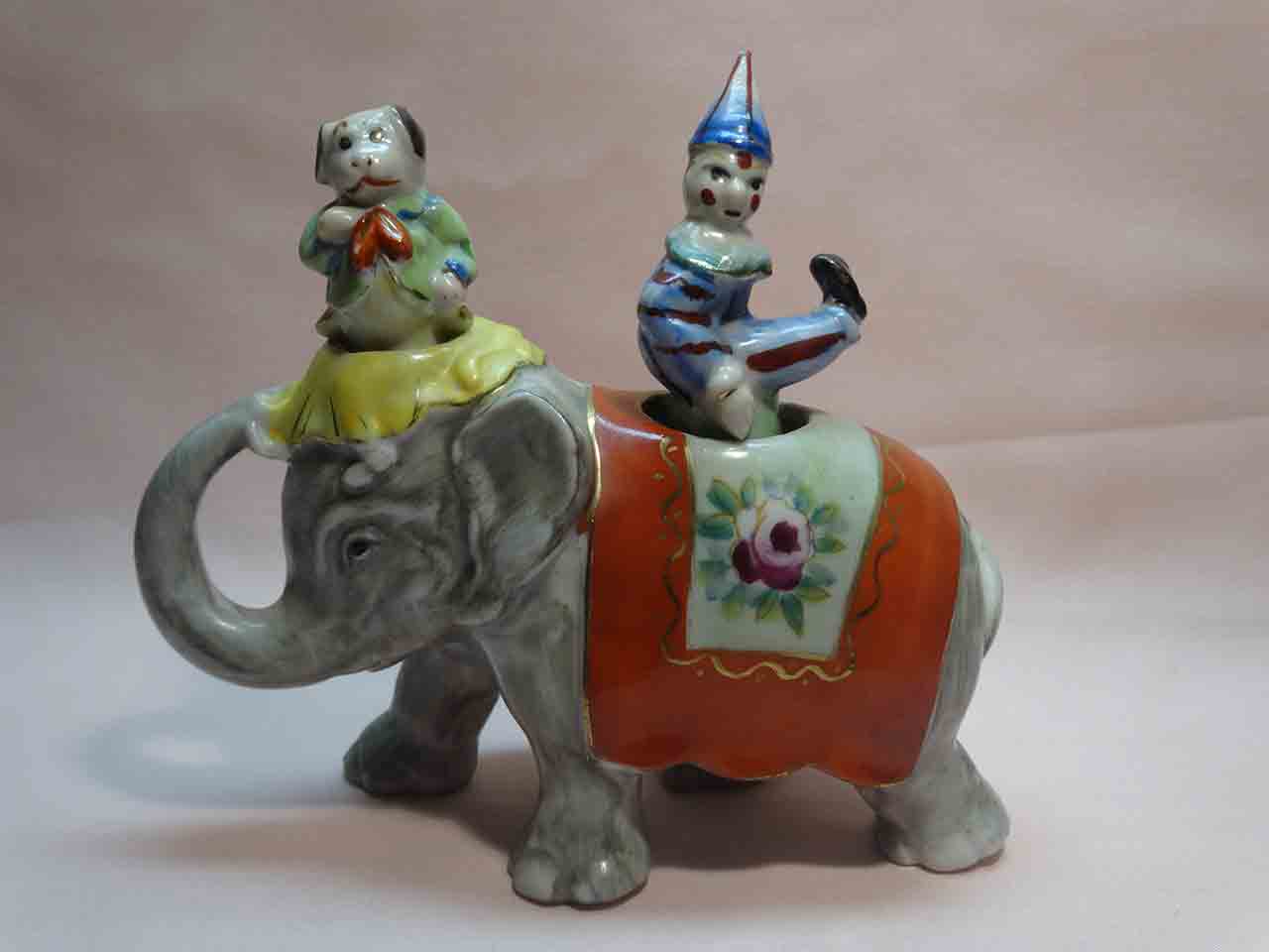 Walking elephant nodder with circus clown and dog as salt and pepper shakers