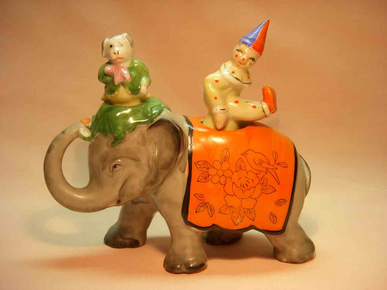 Walking elephant nodder with circus clown and dog as salt and pepper shakers