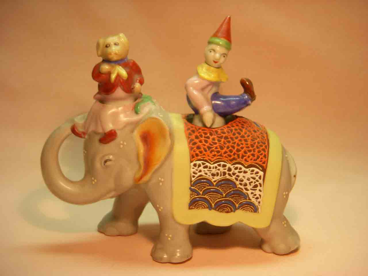 Walking elephant nodder with circus clown and dog as salt and pepper shakers