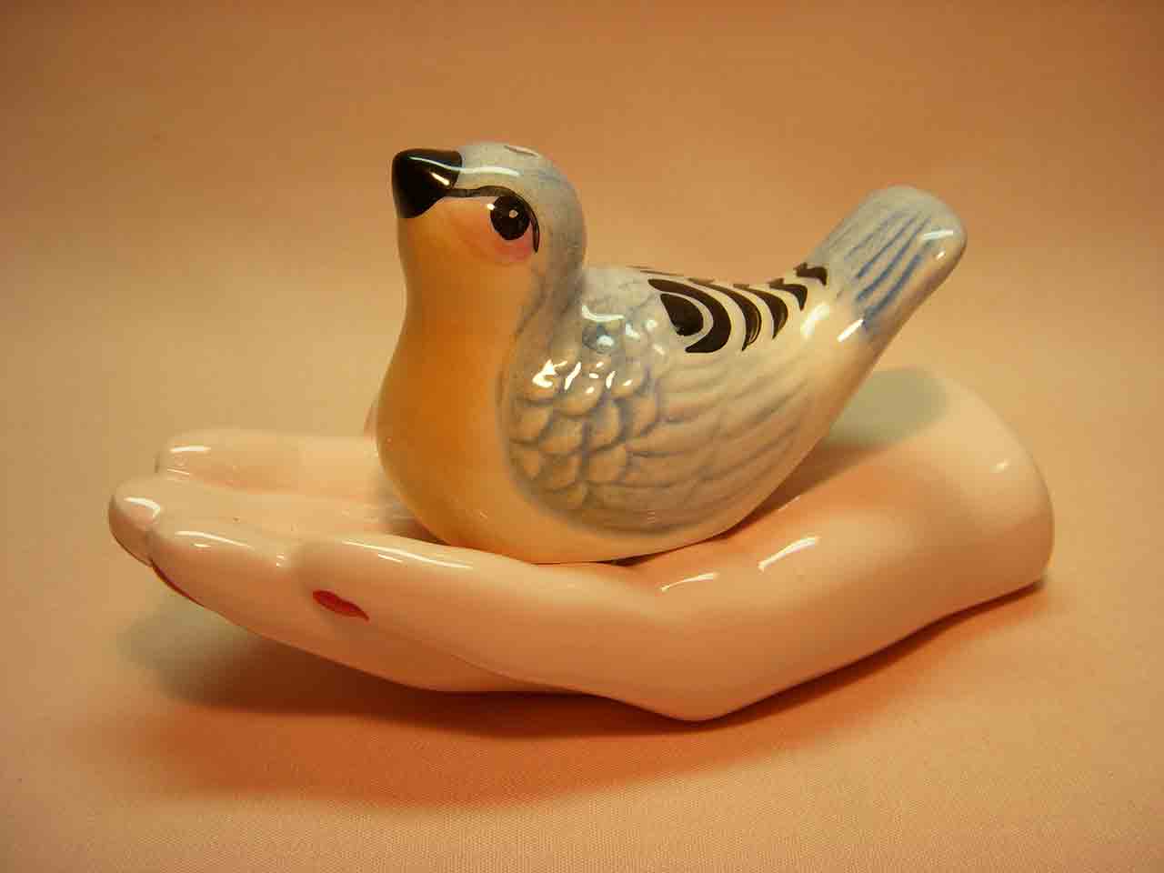 Bird in hand salt and pepper shakers